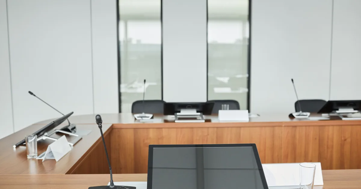 An empty boardroom table, where a company's strategic decisions are actually taken