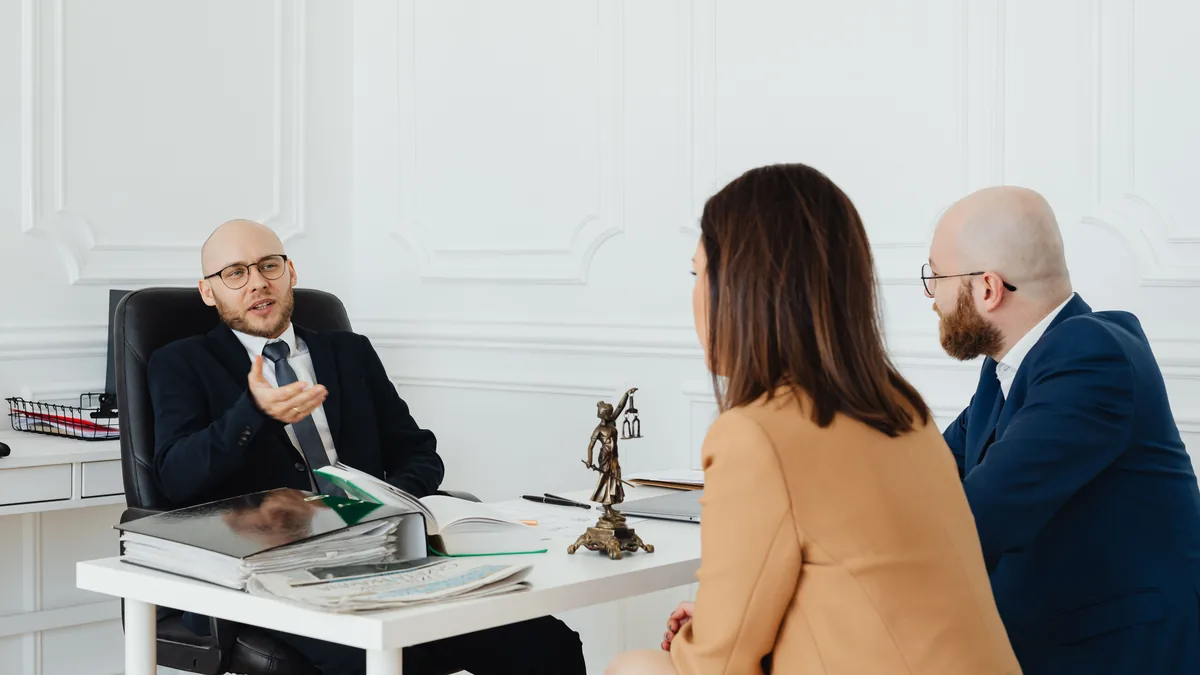 A compliance and legal team discussing a regulatory filing around a table