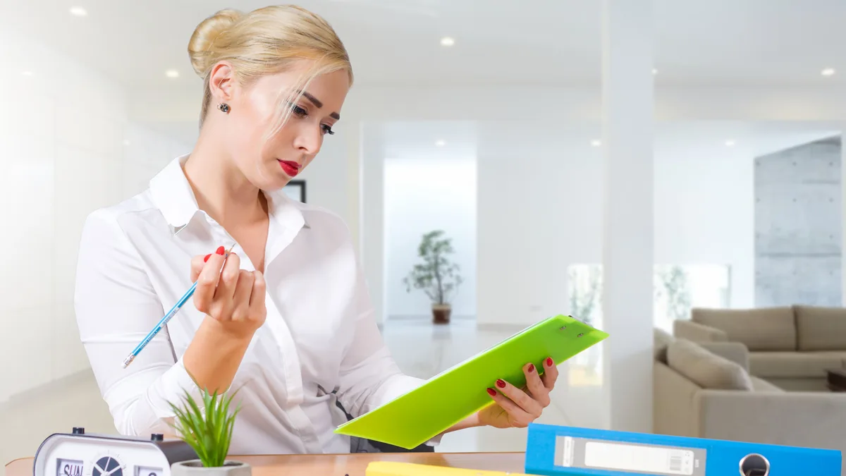 A compliance officer reviewing a crypto-asset white paper document on a laptop