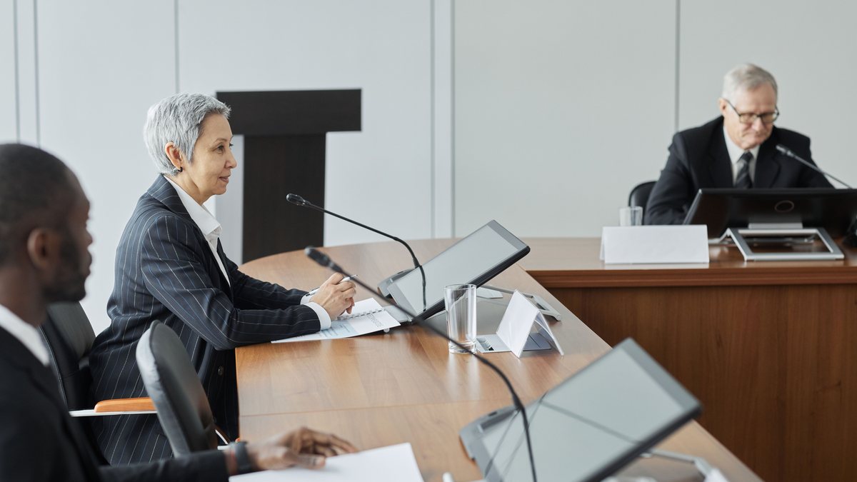 A small boardroom meeting representing the company-office route