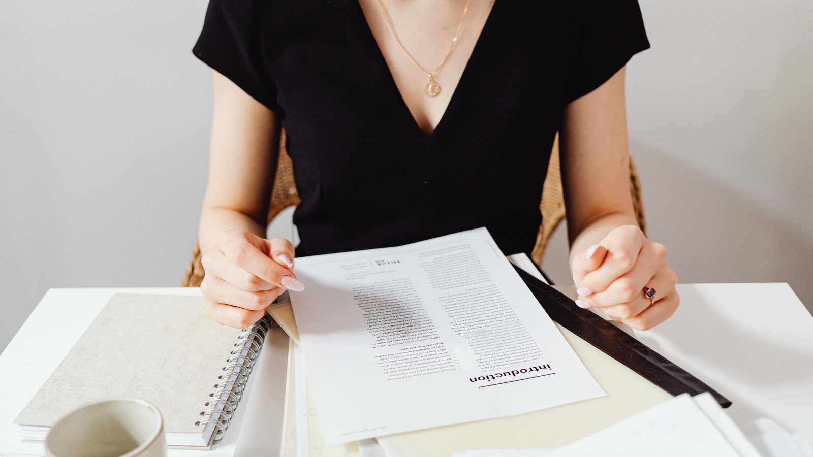 Reviewing visa and company registration documents at a desk