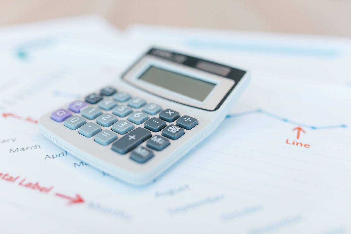 A calculator on printed financial working papers