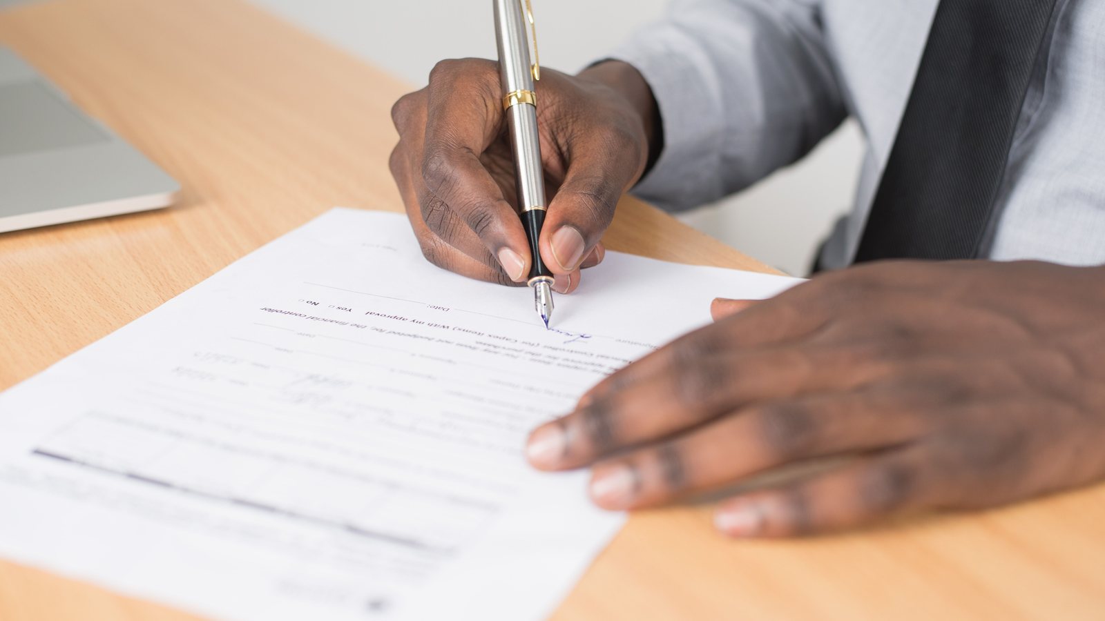 Notary and founder reviewing an S.r.l.s. incorporation deed in Italy.