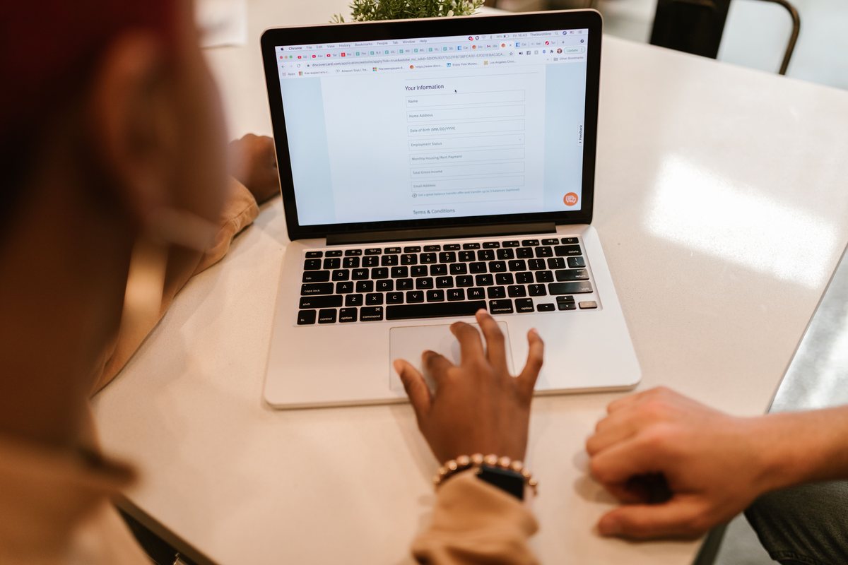 Founder filing a business registration electronically from a laptop