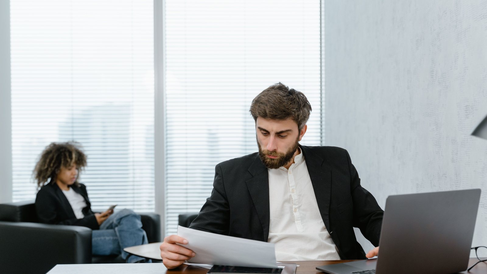 Reviewing a startup visa application at a desk
