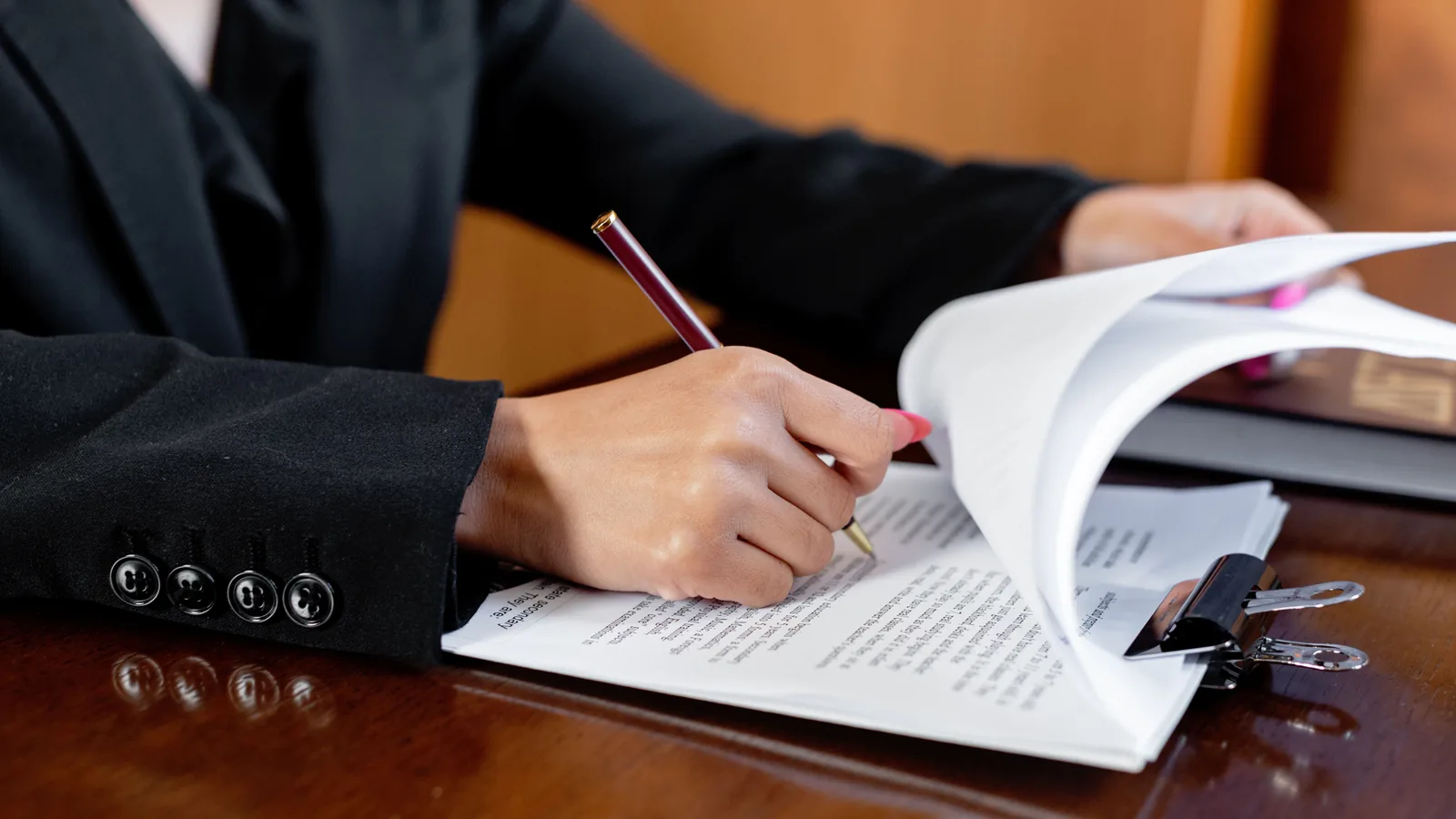A power of attorney and corporate documents being reviewed before an Italian notarial deed